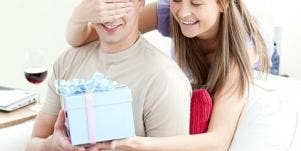 woman giving husband birthday present
