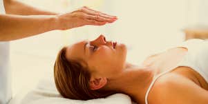 Women receiving reiki treatment