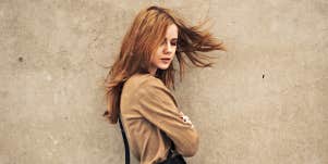 redhead woman tossing hair
