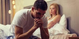 man and woman looking frustrated on bed
