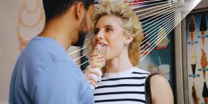woman licking ice cream cone 