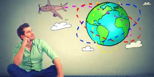 man looking at an image of a plane circling the globe