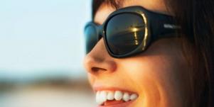 smiling woman wearing shades