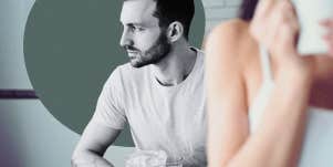 Man spacing out behind woman drinking coffee
