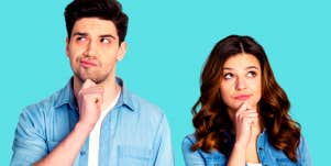 boyfriend and girlfriend in front of turquoise background wondering if they should break up