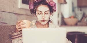 woman working at home in curlers