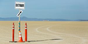 detour sign in the sand