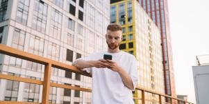 man looking at phone