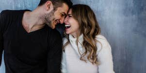 man looking at woman he is falling in love with smiling