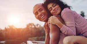 woman hugging boyfriend who is husband material