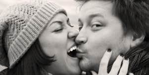 playful couple kissing each other