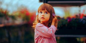 little girl in garden