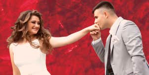 man kissing woman's hand