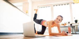 woman practicing meditation at home