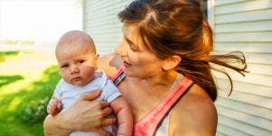 single mom holding baby