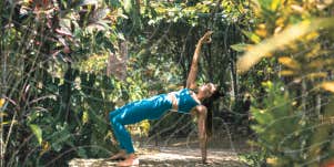 Author doing yoga in amazon forest