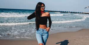 woman posing by the ocean