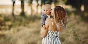 mom holding baby