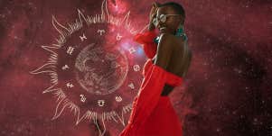 woman in red dress sun zodiac wheel