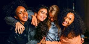 gang of friends embracing each other