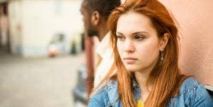woman who's been betrayed looking away