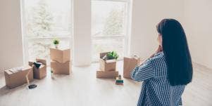 woman looking at boxes of things