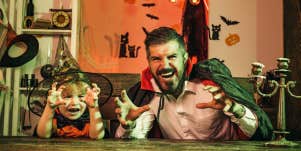 Dad and his son in Halloween costumes