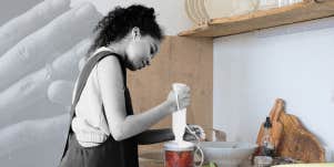Woman passionately cooking