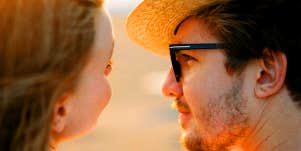 man looking into woman's eyes