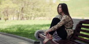 woman sitting on bench