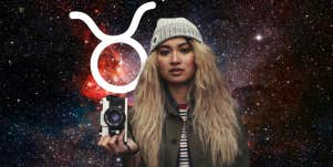 woman with camera and taurus zodiac symbol