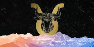 taurus zodiac symbol behind mountains