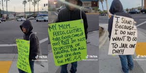 teen wears a sign on the street as punishment
