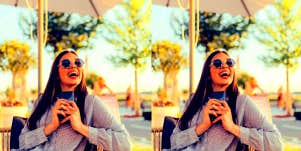 woman holding her phone excited to text after a first date