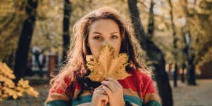 woman holding a leaf