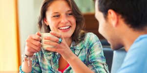 woman talking to man over coffee