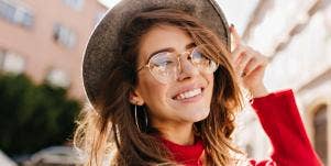 woman smiling with glasses on