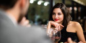 man and woman chatting on dinner date