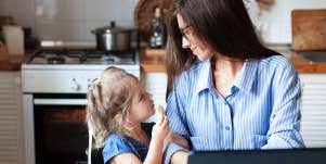 little girl asking mom a question