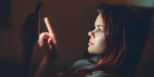 woman scrolling on phone