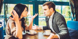 couple arguing over table