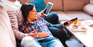 man and woman laying on a couch