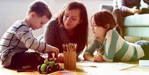 mother playing with children