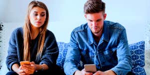 woman with trust issues glancing at her boyfriend's phone