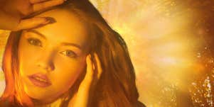 woman surrounded by light