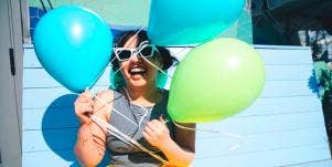 woman with balloons considering relationship red flags