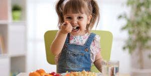 young girl eating food