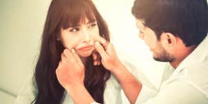 boyfriend trying to make girlfriend smile at joke that is really verbal abuse