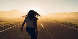 woman walking down road