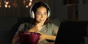 woman watching movie online together with someone far away
